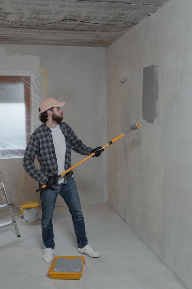 Man Painting a wall