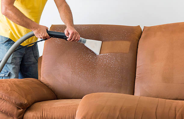 cleaning sofa pillow with steam cleaning in home